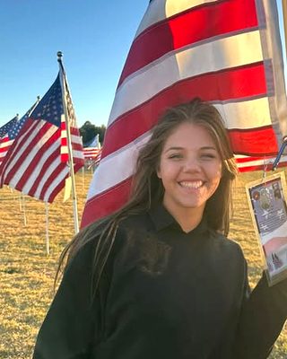 Britton Lowenthal, piano teacher at Anthem Music, at the Plano Flags of Honor