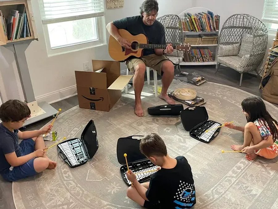 Dan Brady teaching a group of young students at Anthem Music